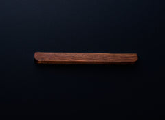 Front view of a rectangular American walnut cabinet handle with a rich dark brown finish