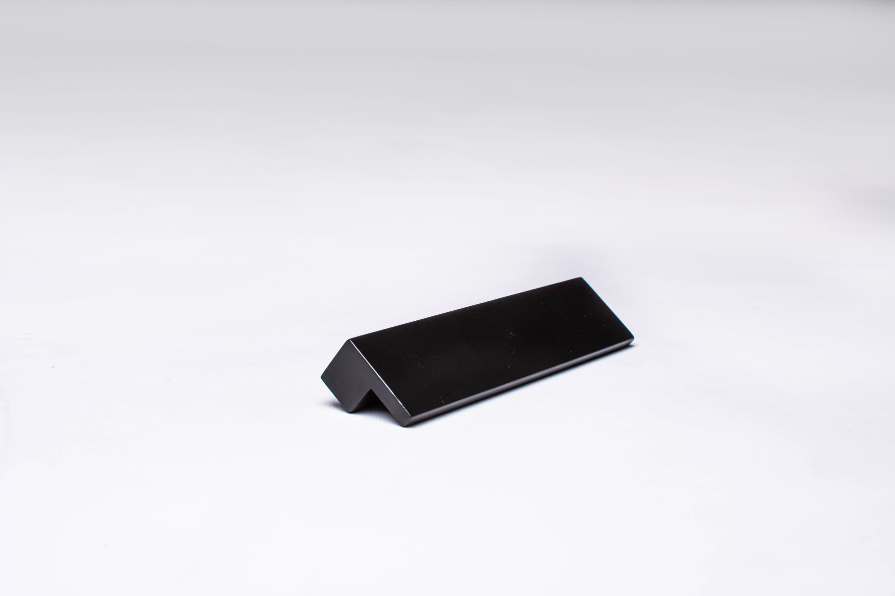 Black wooden finger pull frontal view