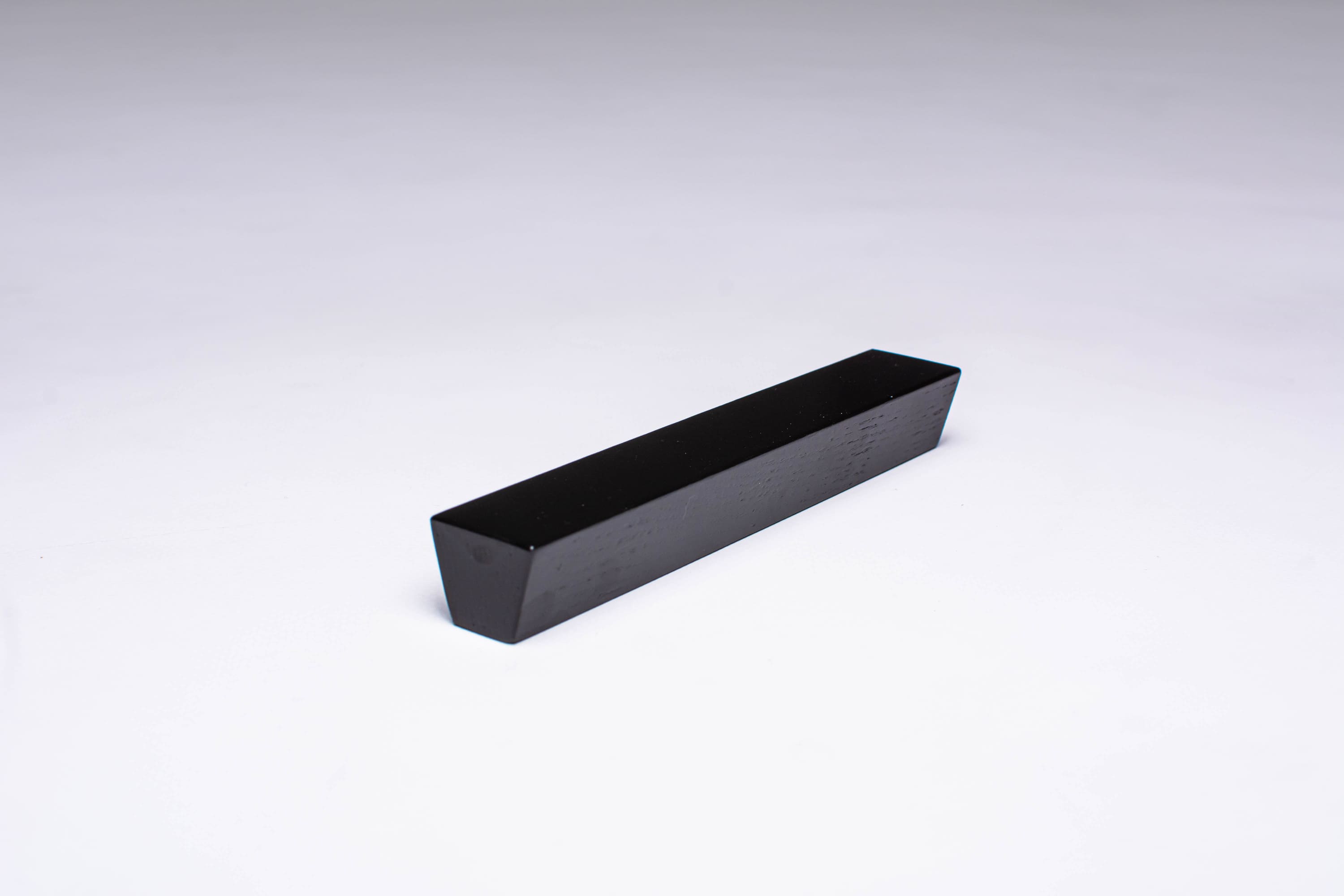 Black Wooden Ash Trapezoid Cabinet Handle in close view