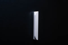 Classic Rounded White Cabinet Handle on grey