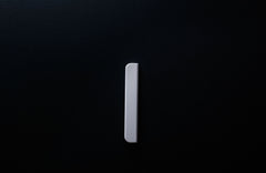 Classic Rounded White Cabinet Handle on grey