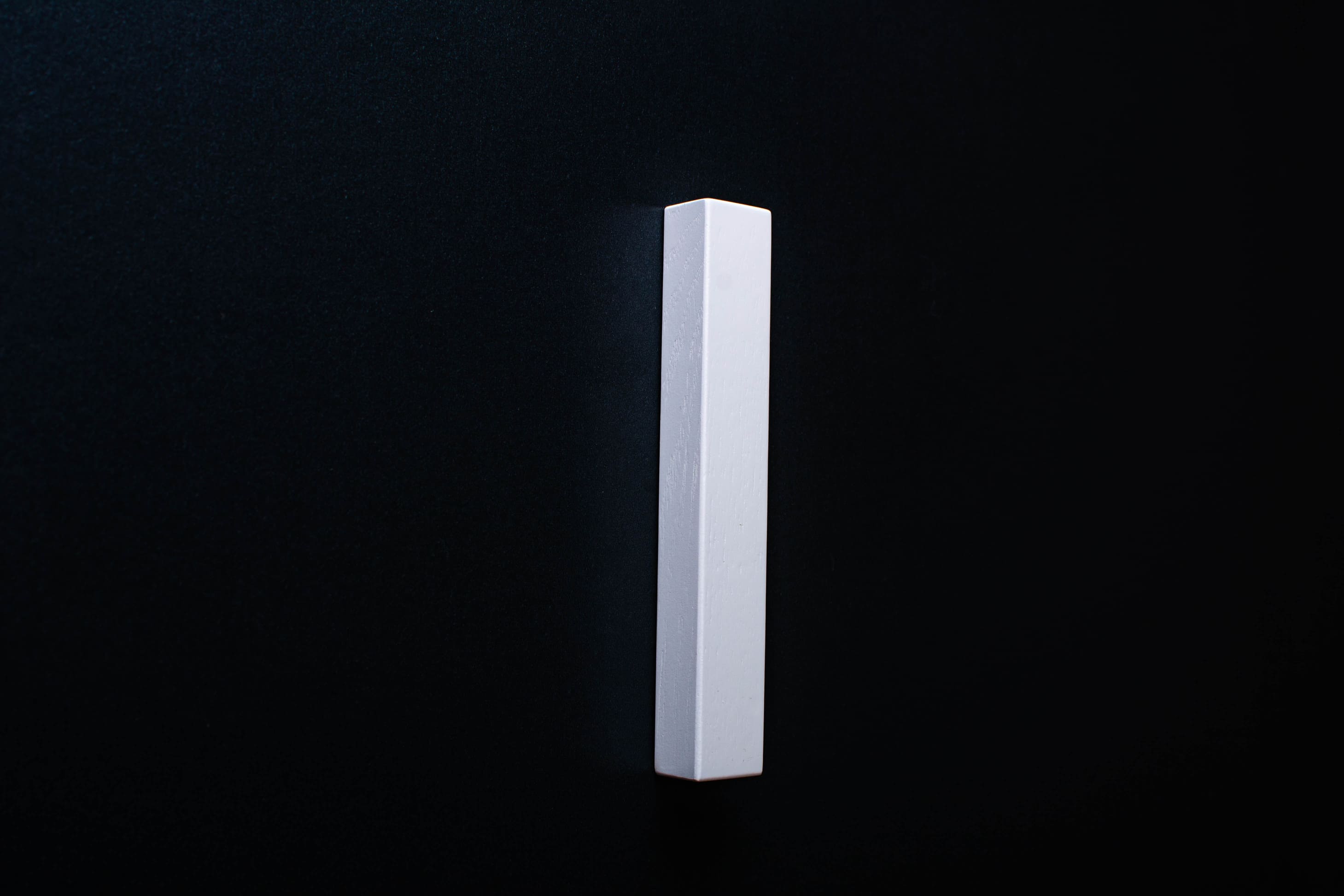 Classic Trapezoid White Cabinet Handle on grey