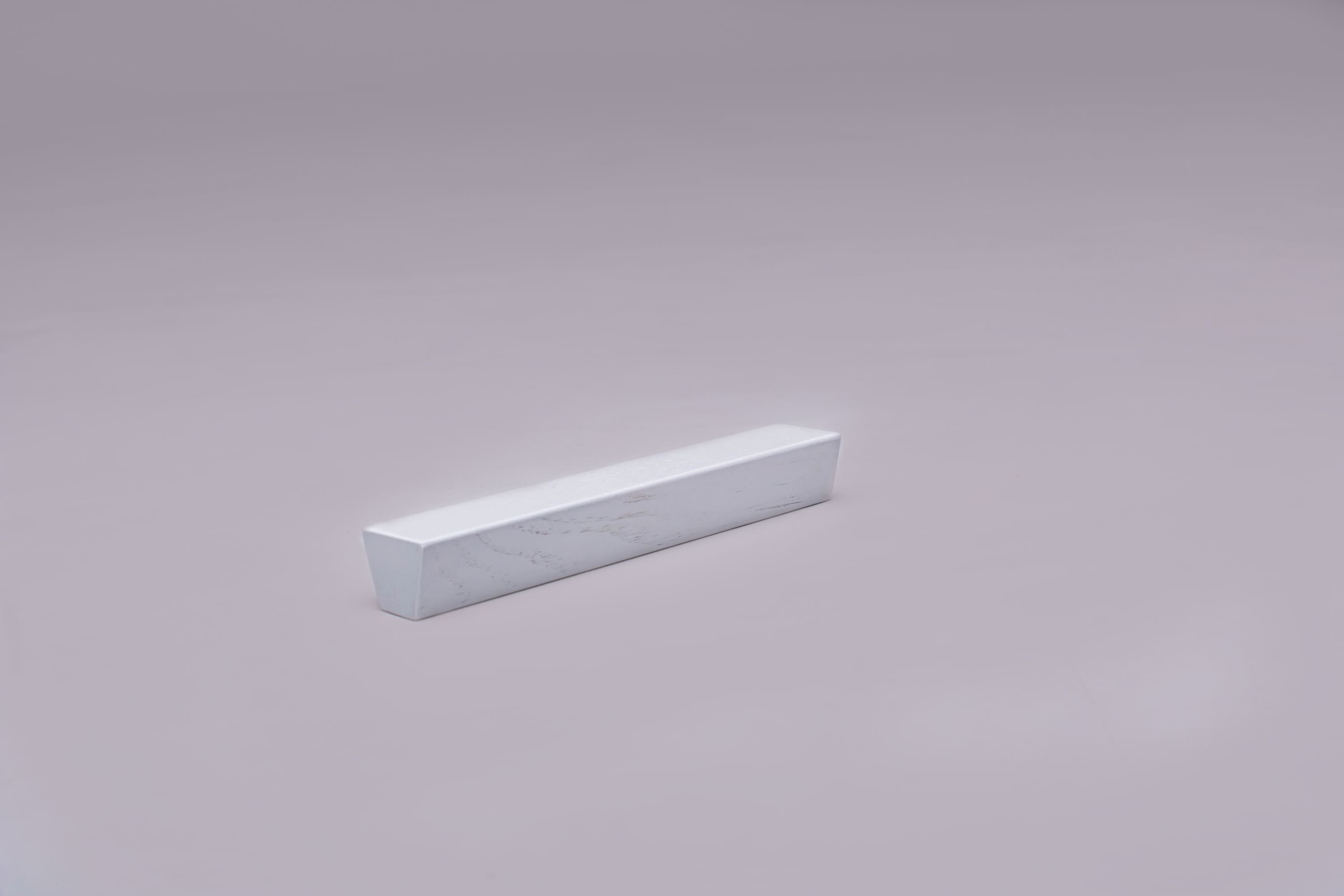 Classic Trapezoid White Cabinet Handle on grey