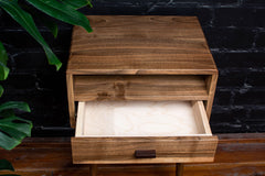 European walnut nightstand with legs attached, ready for assembly