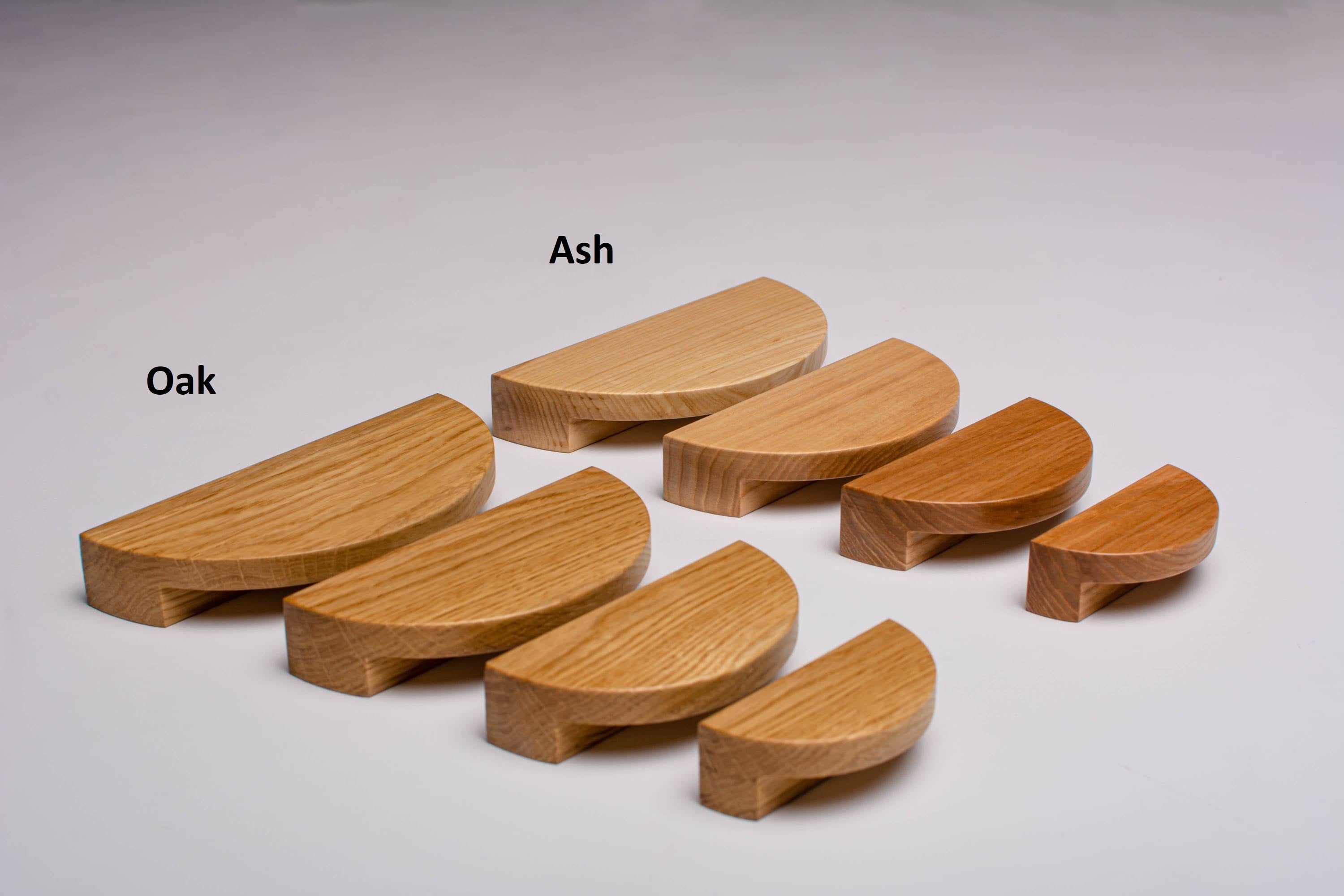 the photo shows 4 sizes of half moon handles in oak and ash