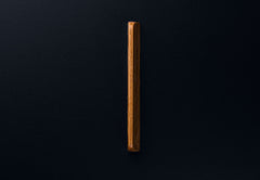 Symmetrical oak drawer handle in matte finish, close frontal perspective