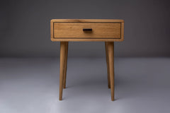 Handcrafted Mid-Century oak nightstand with a sleek design.