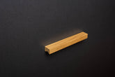 Oak cabinet Handle on black cabinet
