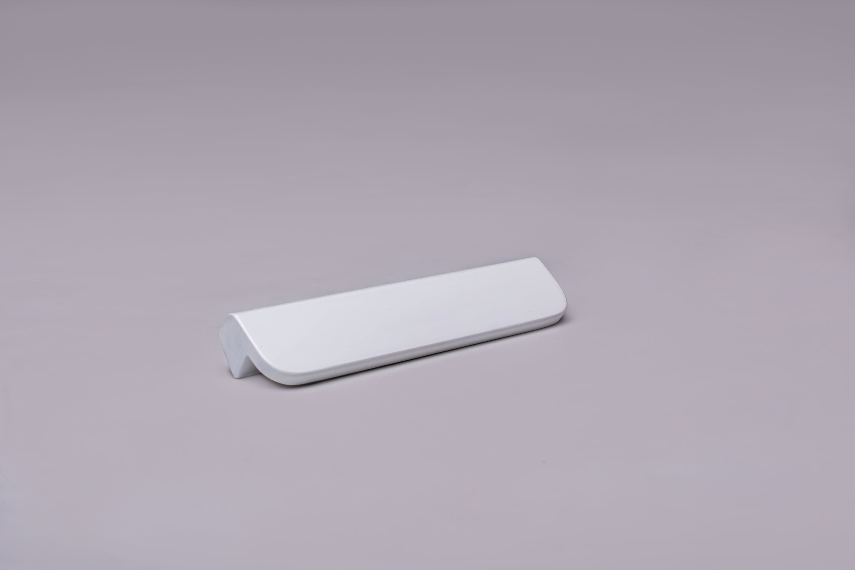 Modern L-Form White Cabinet Handle on gray