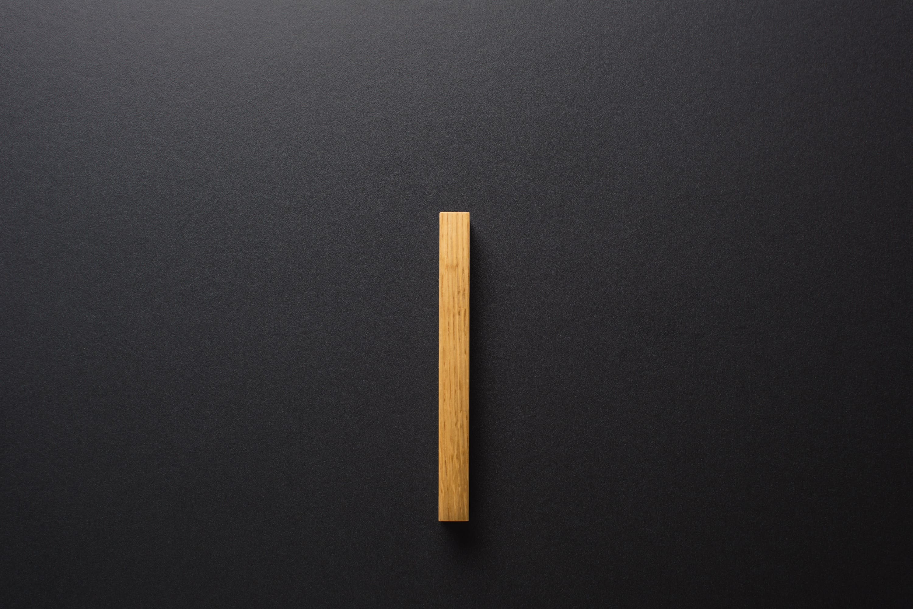 Wooden drawer oak handle in vertical position with detailed frontal view