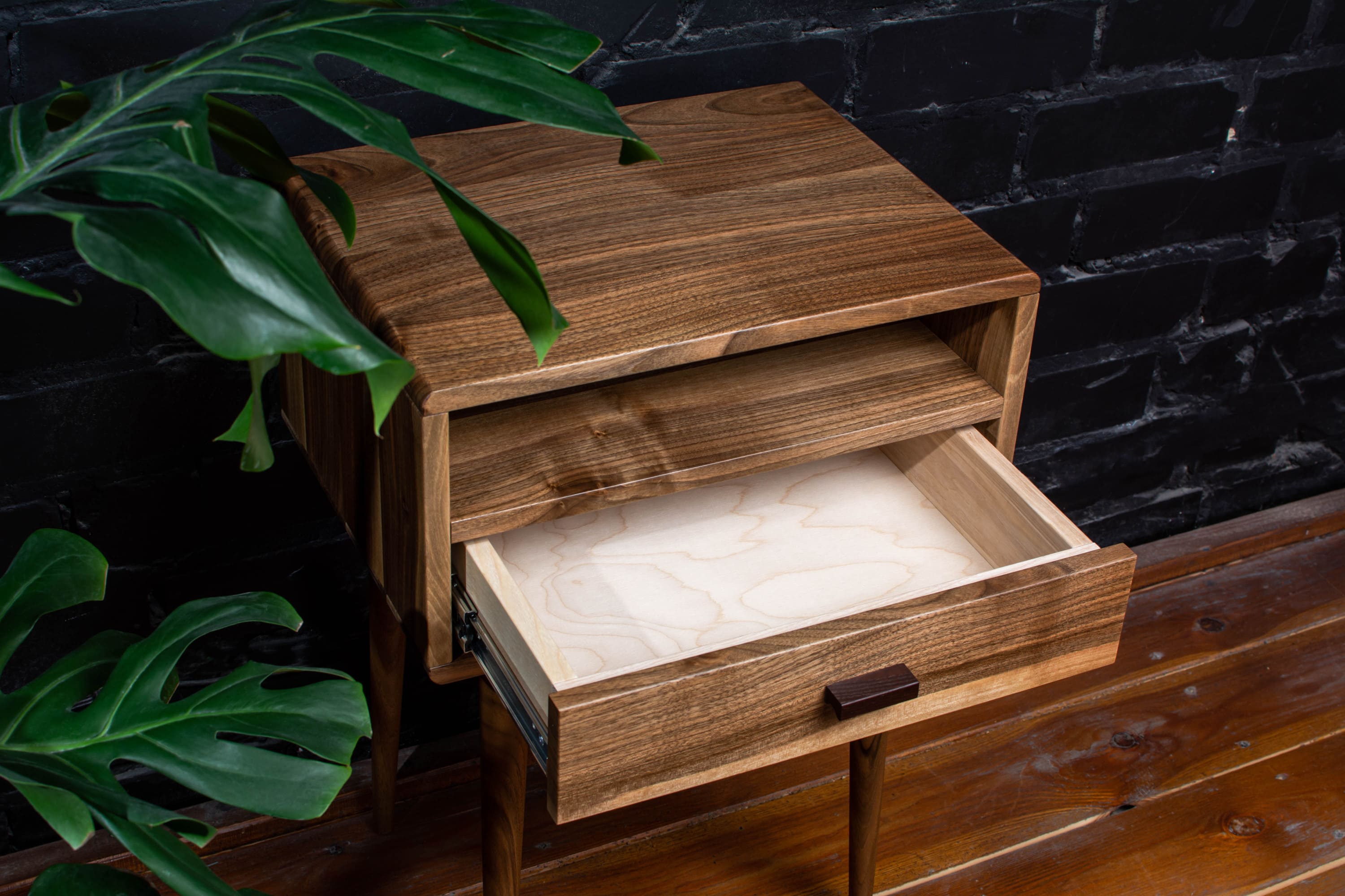 Modern nightstand showing ample storage space for books and essentials