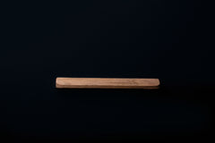 Raw European walnut cabinet handle with visible grain and natural texture
