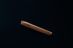 European walnut handle showing pre-drilled mounting holes from the underside