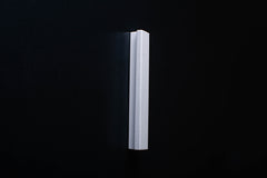 White Wooden drawer  handle in vertical position with detailed view on grip