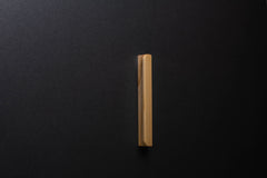 Wooden drawer modern ash handle in vertical position with detailed view on grip