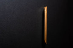 Wooden drawer ash handle in vertical position with detailed view on grip