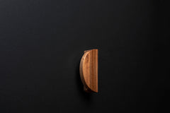 Wooden drawer European walnut handle in vertical position with detailed view on grip
