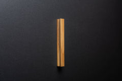 Wooden drawer ash handle in vertical position with detailed view on grip