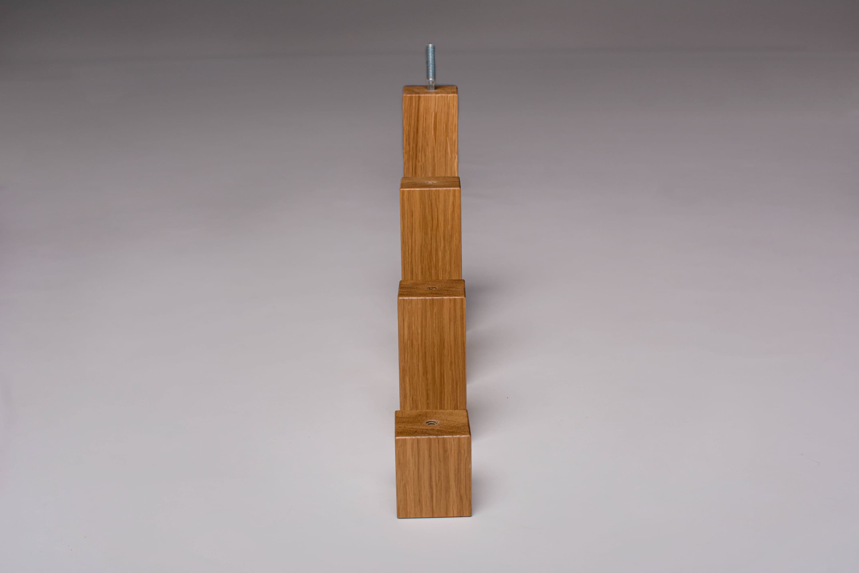 four oak wood square legs in a row
