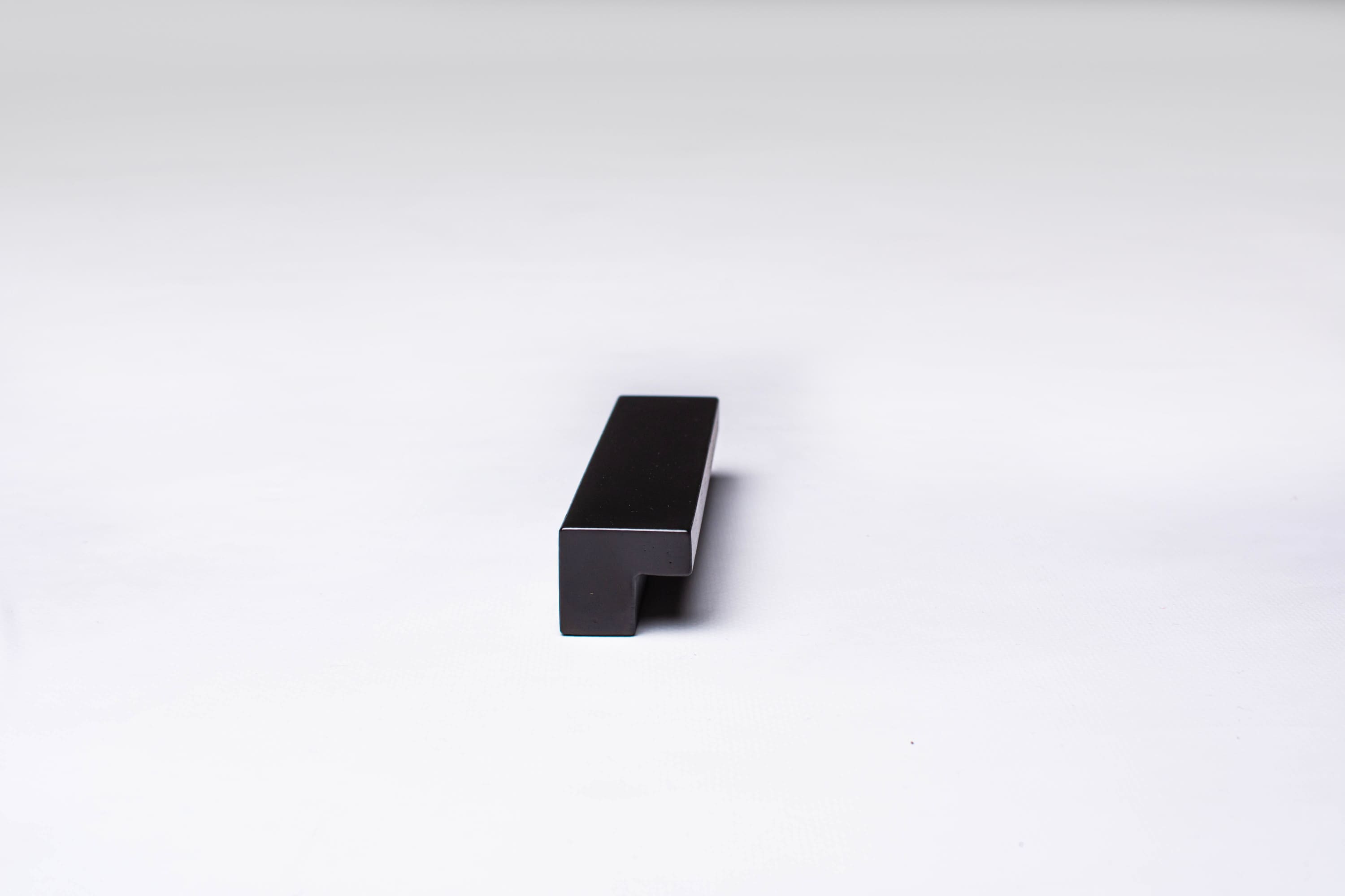 Classic L-Form Black Cabinet Handle on gray 