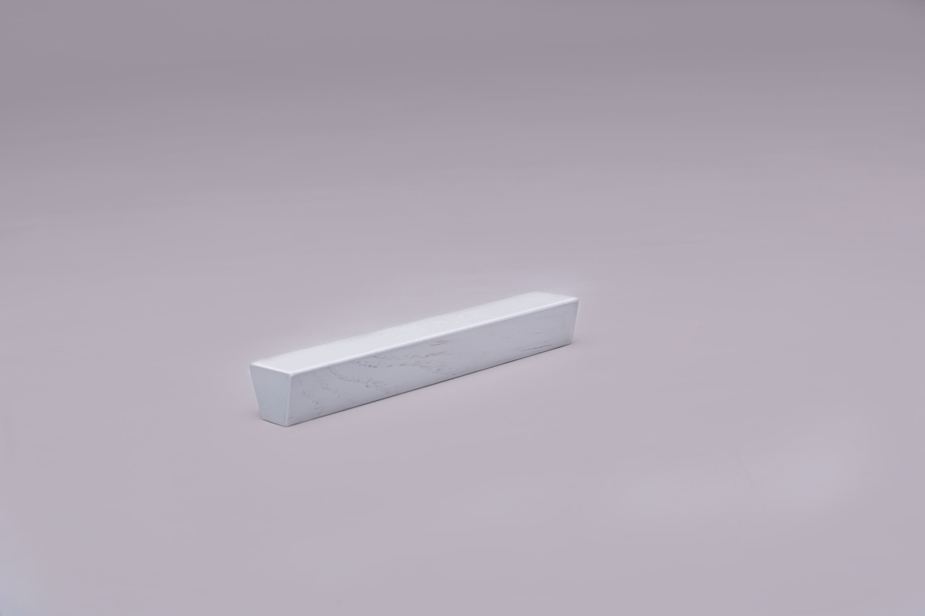 Classic Trapezoid White Cabinet Handle on grey 