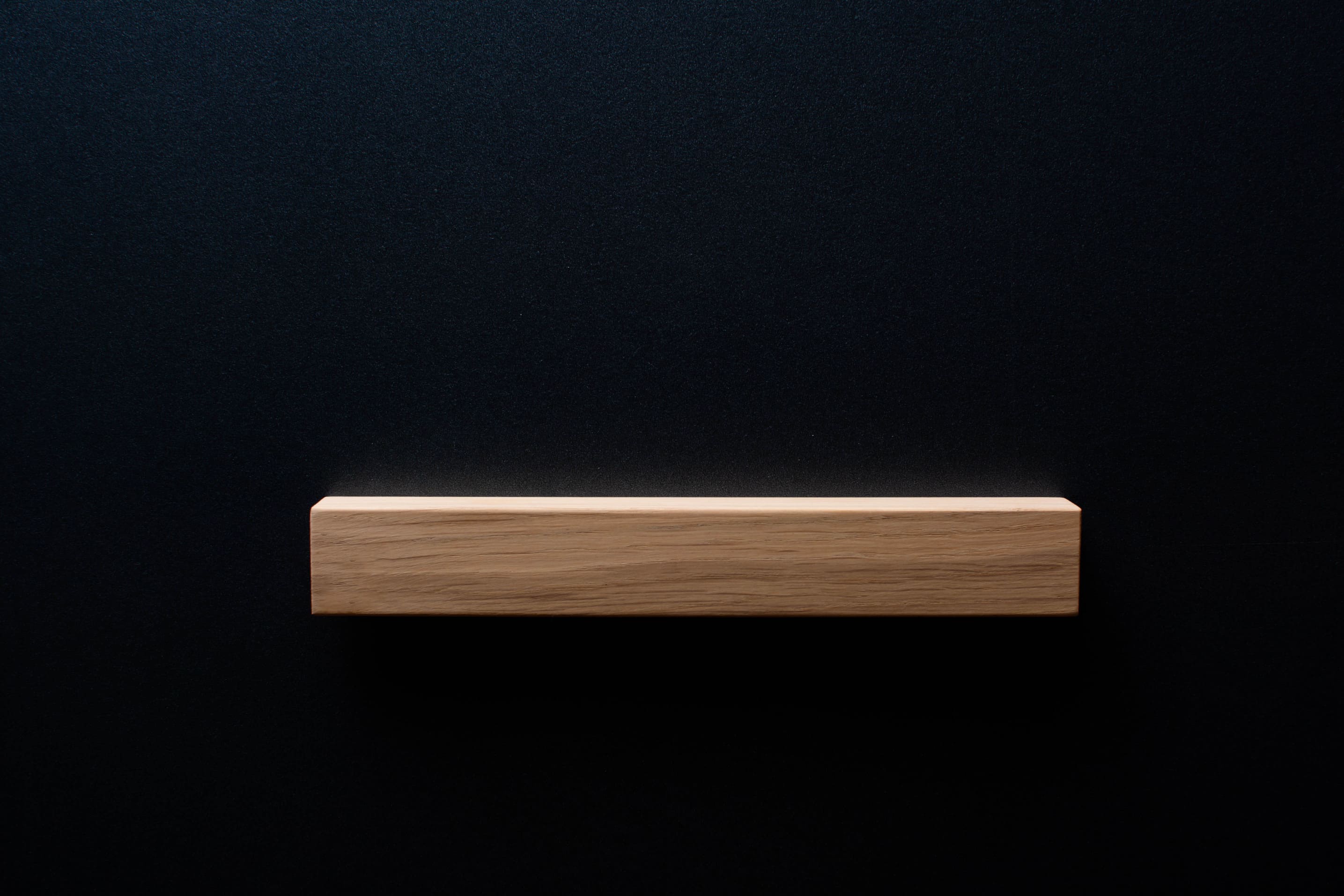Close-up of natural oak wood texture on furniture handle