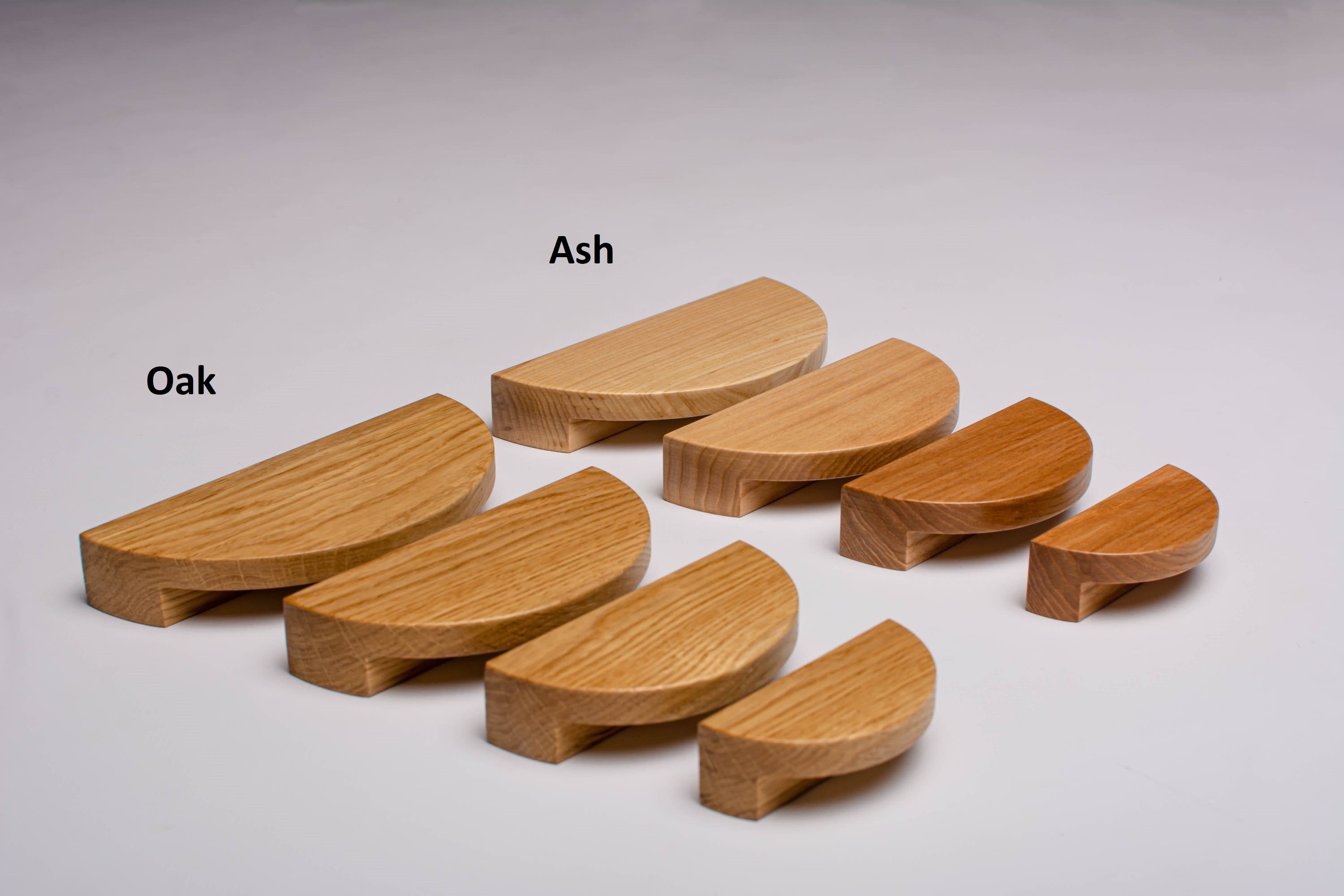 the photo shows 4 sizes of half moon handles in oak and ash 