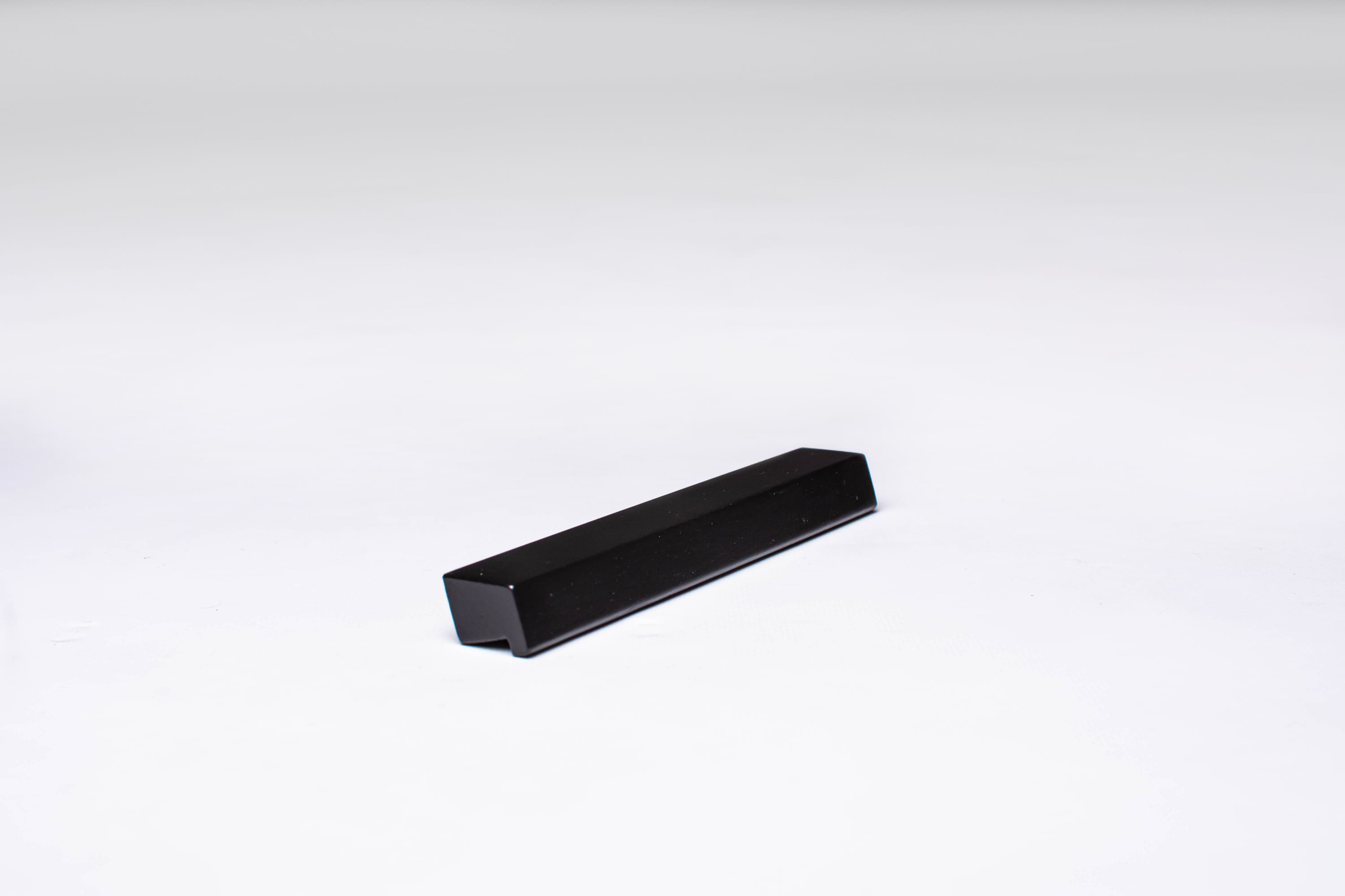 Black wooden finger pull frontal view