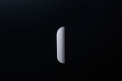 White Wooden drawer  handle in vertical position with detailed view on grip