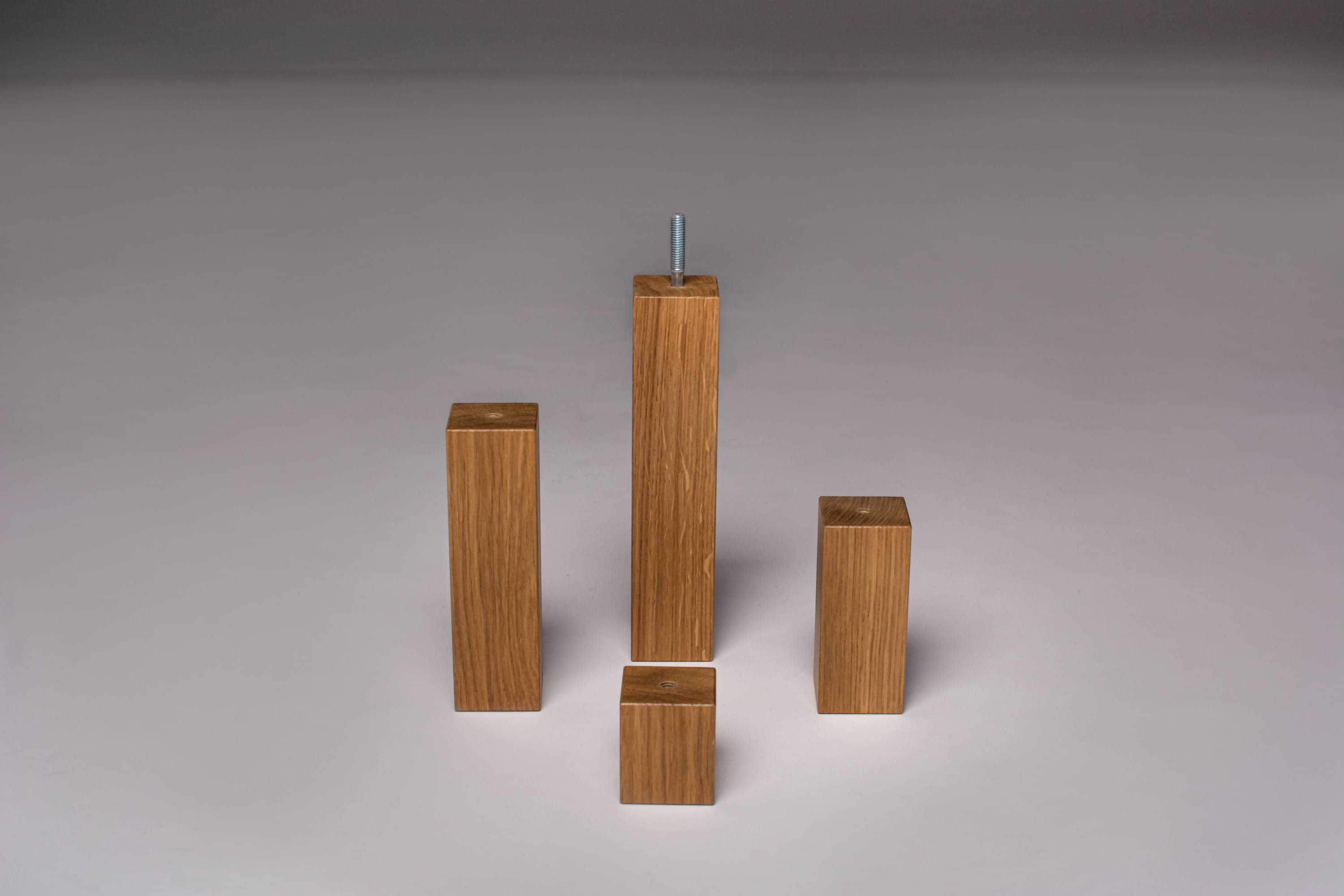 Set of four oak square legs showing oak texture