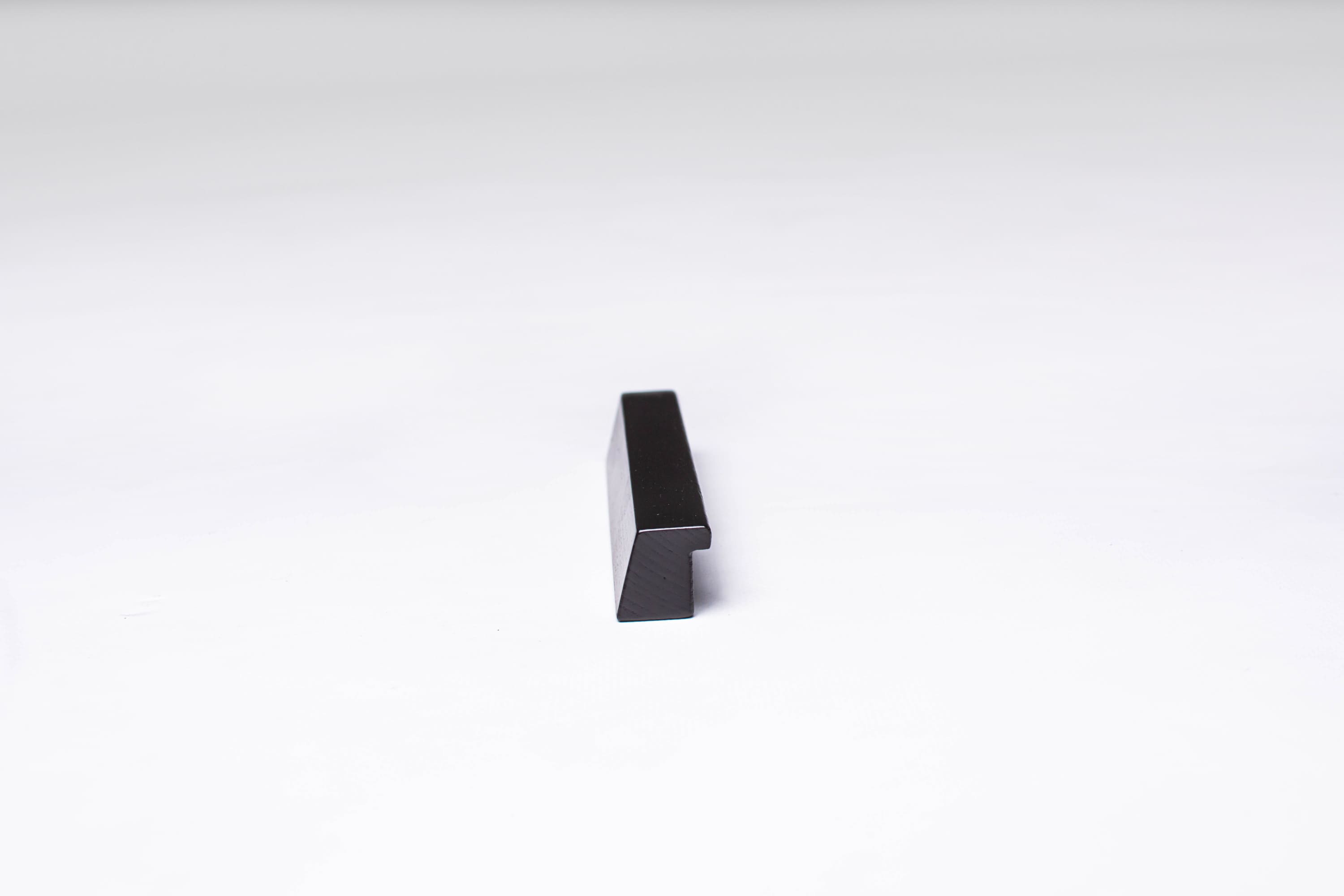 Black Wooden Ash Minimalistic Cabinet Handle in close view