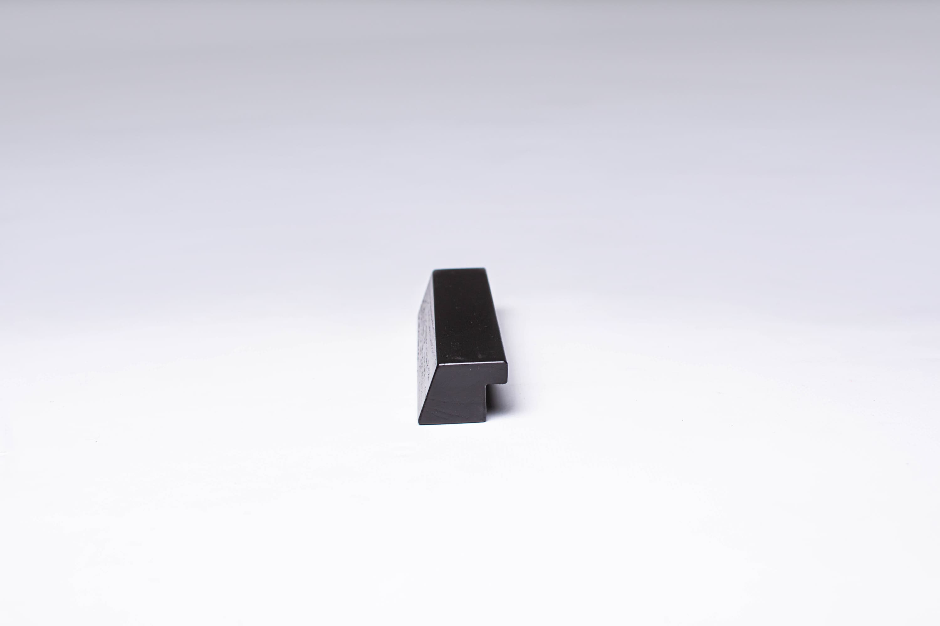 Black Wooden Ash Minimalistic Cabinet Handle in close view