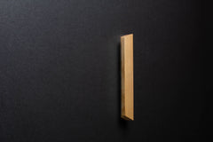 Wooden drawer angled ash handle in vertical position with detailed view on grip