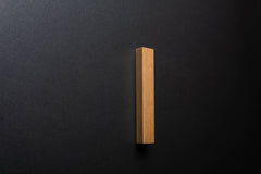 Wooden drawer trapezoidal ash handle in vertical position with detailed view on grip