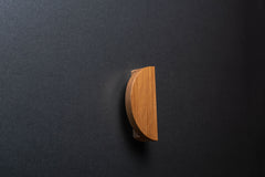 Wooden drawer ash handle in vertical position with detailed view on grip