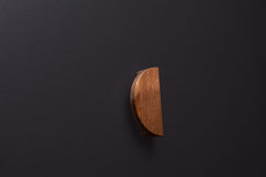 Wooden drawer American walnut handle in vertical position with detailed view on grip